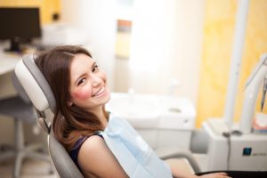 young adult girl in dental chair